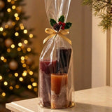 Lotus Kaarsen cadeauset kleurverloop warm: Wine Wood, Stone Red en Cognac in een cellofaan zakje met gouden lint